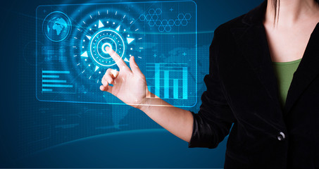 Woman pressing high tech type of modern buttons