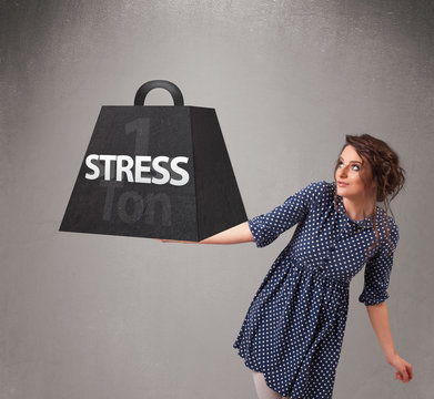 Young woman holding one ton of stress weight