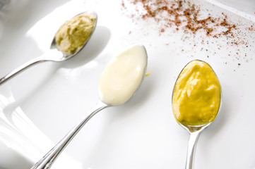 close up mustard on spoon