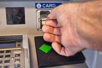 By inserting a credit or debit card, money can be removed.