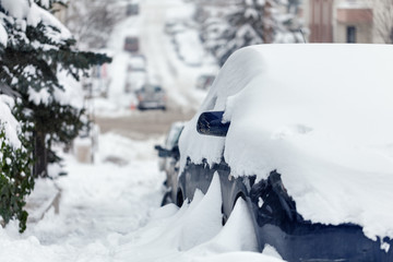 Cars and roads covered with snow
