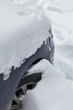 car under snow after snowfall