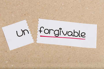 Sign with word unforgivable turned into forgivable