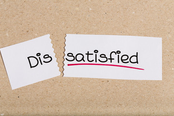 Sign with word dissatisfied turned into satisfied
