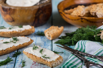 wholegrain bread with fresh dill and soft cheese