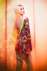 Fashion photo of blonde woman in colourful dress
