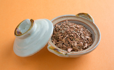 Witch hazel bark in small bowl with lid