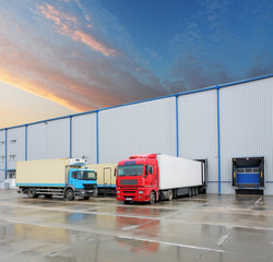 Cargo truck at warehouse building - obrazy, fototapety, plakaty