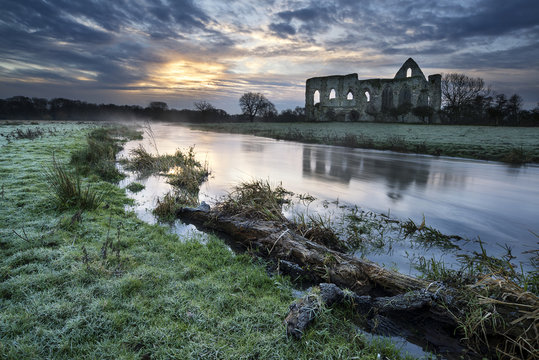 Beautiful sunrise landscape of Priory ruins in countryside locat