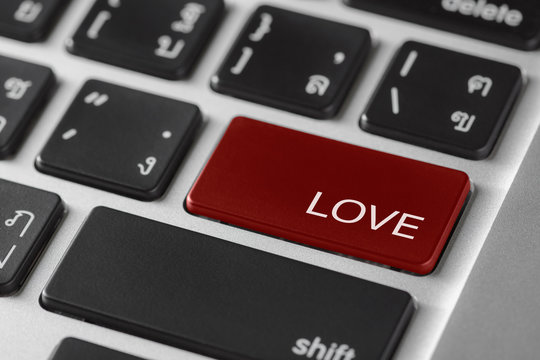 computer notebook keyboard selected focus on  red enter button w