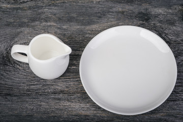 Vintage table setting with  plate and  milk jug