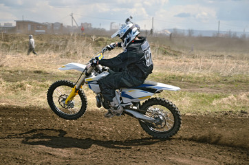 MX rider on a motorcycle in a bend