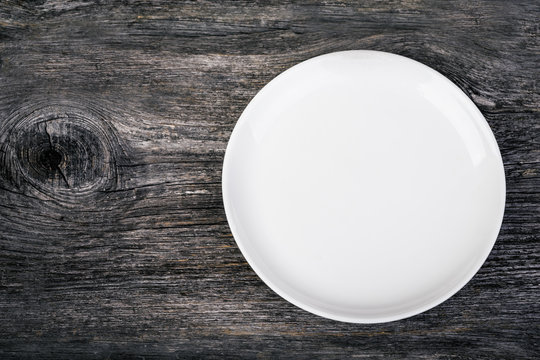 white plate on the wooden background