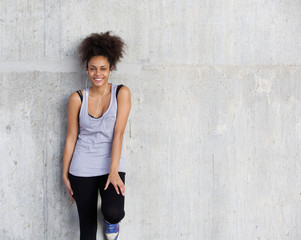 Fototapeta premium Cute young sports woman smiling with earphones