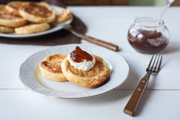 breakfast with cheese pancakes, coffee and jam