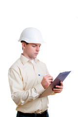 Engineer in helmet writing something