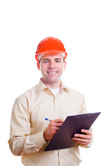 Engineer in helmet writing something