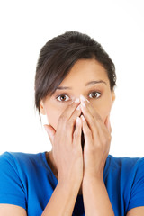Frightened woman covering with hands her mouth