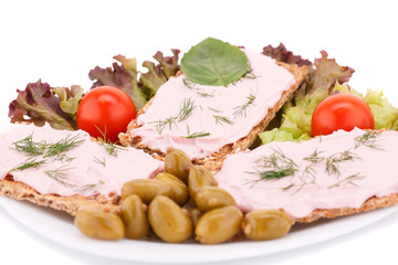 Cracker with fresh vegetables and cream