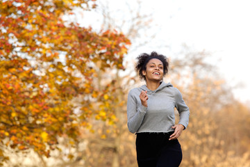 Healthy young woman jogging outdoors