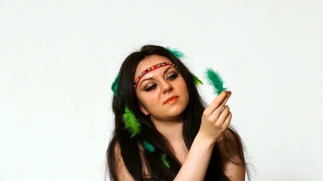 beautiful young woman face close up with hippie art make up