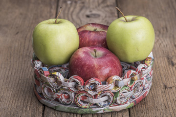 Apples on a support made of recycled paper