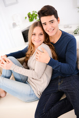 lovely cheerful young couple man woman happy together home