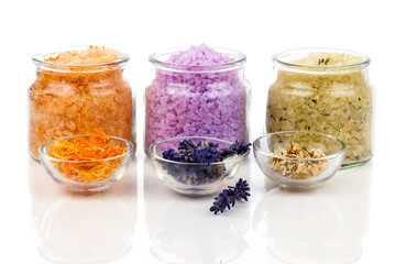 various kinds of bath salt with flowers, isolated on white backg