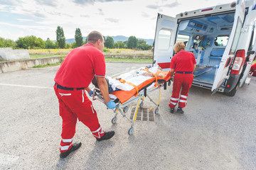 Rescue Team Providing First Aid © william87