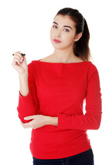 Naklejka premium Portrait of a student woman holding pen
