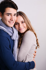 close up studio portrait of a beautiful young couple man woman
