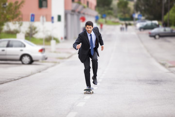 Businessman skateboarding