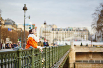 Fototapeta na wymiar Happy young woman in Paris
