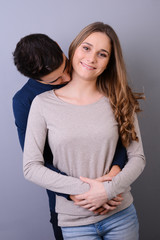 close up studio portrait of a beautiful young couple man woman