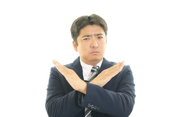 禁止の意思表示をするビジネスマン