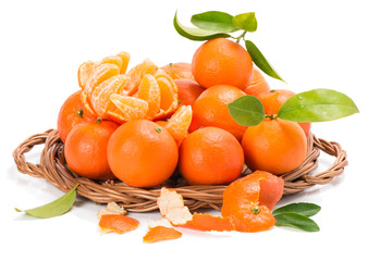 clementines or tangerines with segments and  leaves
