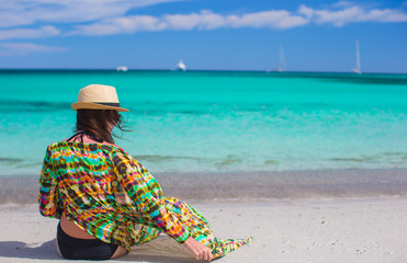 Young girl on seashore during summer vacation