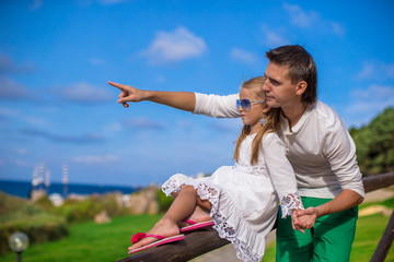 Adorable little girl and happy dad outdoor