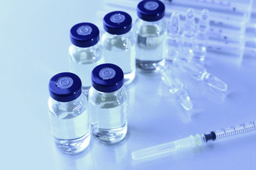 Vaccine in vial with syringe