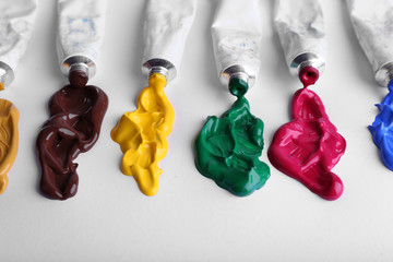 Colorful paint strokes on sheet of paper background