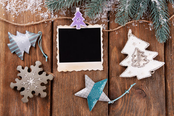 Blank photo frames and Christmas decor with snow fir tree