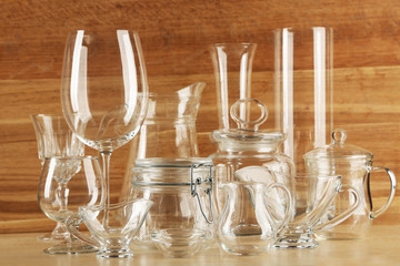 Different glassware on wooden background