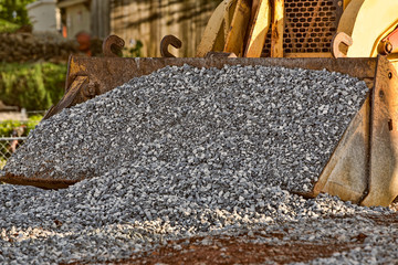 Naklejka premium Scoop of gravel