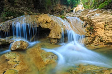 Foto op Plexiglas wonderful waterfall with colorful tree in thailand © wittybear
