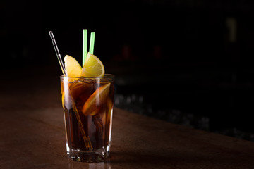 Cuba libre cocktail in a tall glass