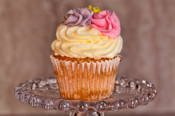 Delicous cupcake on a pedestal.