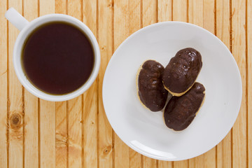 Cup of tea and mini eclairs
