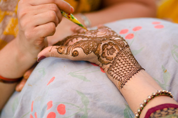 applying henna on hand, wedding ,Rajasthan, India