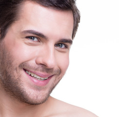 Obraz premium Portrait of handsome smiling young man.