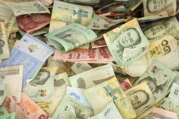 Fototapeta na wymiar Stack of Thai money in donation box